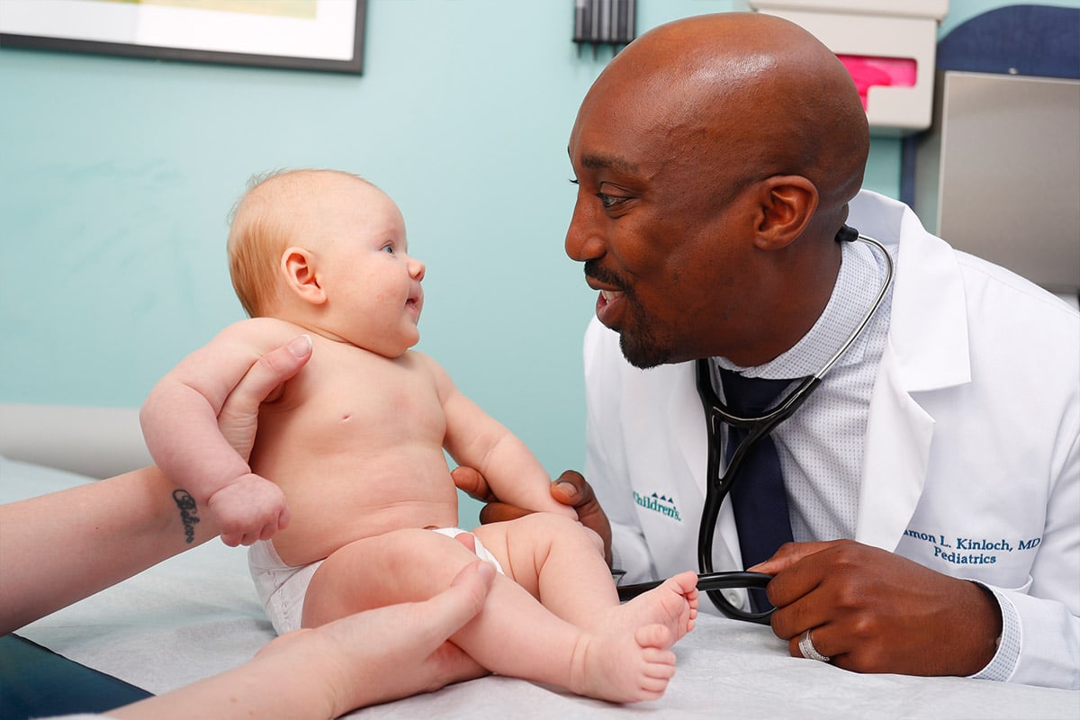 Doctor with newborn